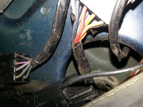 1994 Ford Bronco - The image shows a close-up view of a vehicle's electrical wiring harness and connectors.