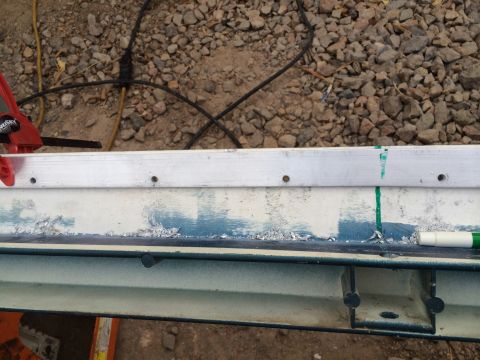 1995 Ford Bronco - Close-up of a vehicle body panel showing wear and tear.