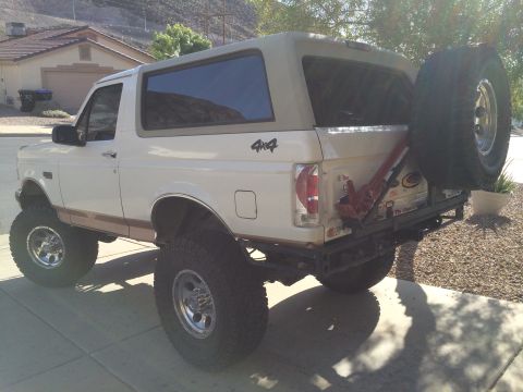 1995 Ford Bronco - This lifted 1995 Ford Bronco is equipped with a rear-mounted spare tire and a Hi-Lift jack.