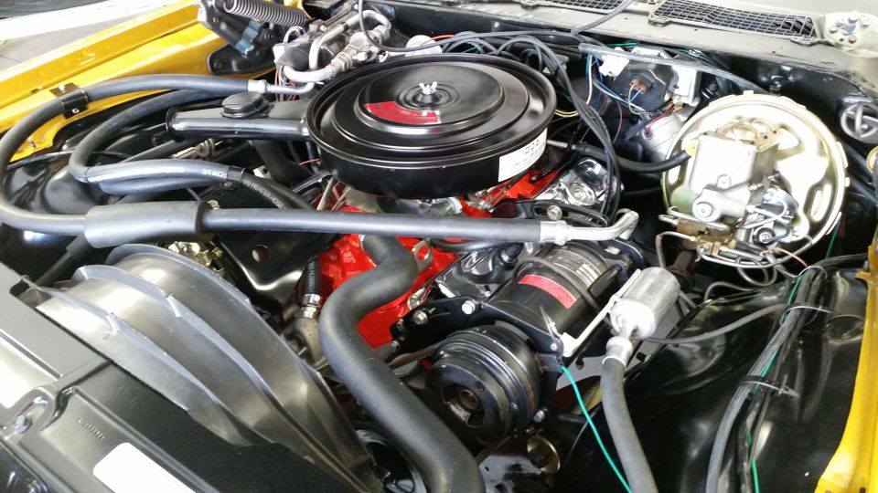 Engine bay with V8 engine, air cleaner, and AC compressor