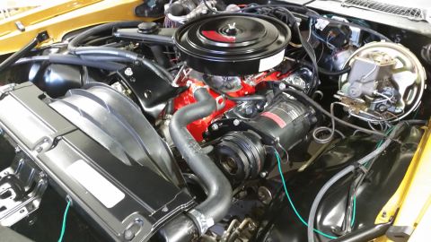 1970 Chevrolet Camaro - Close-up view of a car's engine bay, showing various components and wiring.