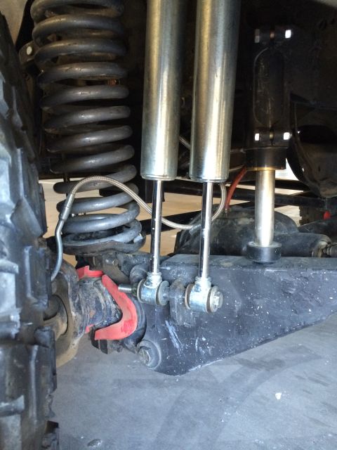 1995 Ford Bronco - Undercarriage view of a 1995 Ford Bronco, highlighting its suspension system with dual shocks and coil springs.