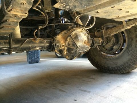 1995 Ford Bronco - Close-up of a vehicle's rear axle and differential assembly.