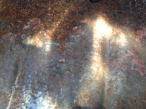 1978 Ford Bronco - The surface shows significant corrosion and discoloration, with some red markings visible.