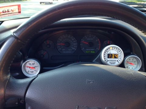 2002 Ford Mustang - The interior of a 2002 Ford Mustang shows a digital air/fuel ratio gauge and other dashboard instrumentation.