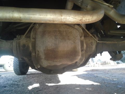 1991 Ford F-250 - Underside view of a truck's rear axle differential and exhaust system.