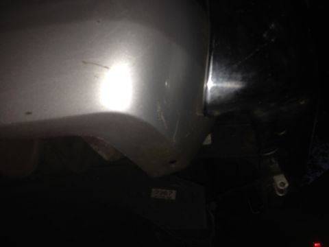 1992 Ford F-150 - Close-up view of a silver truck's fender and headlight area, with some visible wear and a small label reading '2367'.
