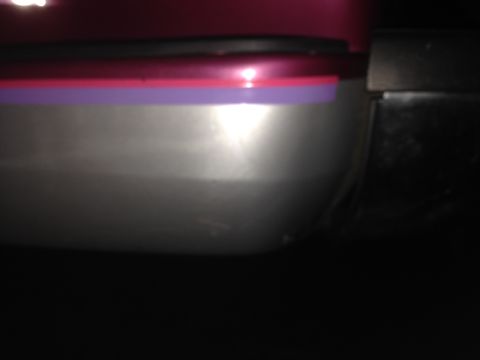 1992 Ford F-150 - Detail of a car's door trim, showing layered colored accents.