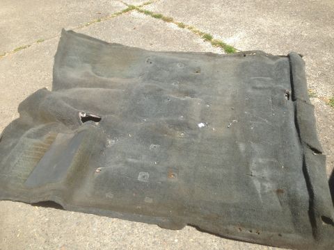 1992 Ford F-150 - Vehicle carpet removed from interior, showing wear and tear.