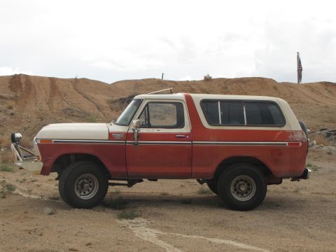 1978 Ford Bronco - This 1978 Ford Bronco is shown in profile, a two-tone red and white paint scheme and a aftermarket front bumper.