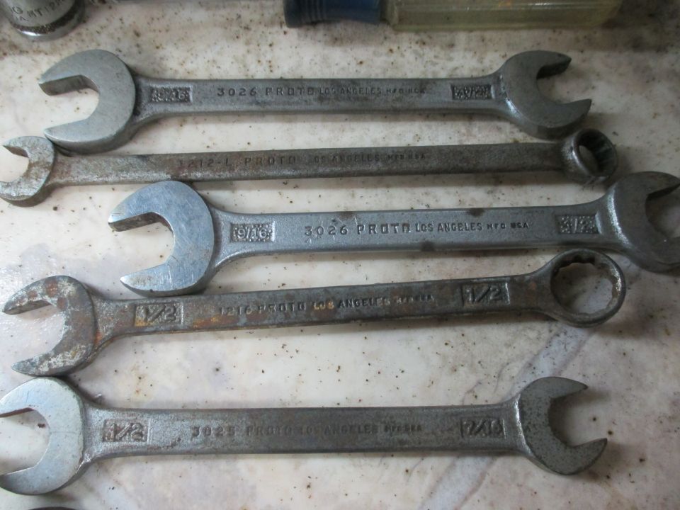 Several Proto wrenches laid out on a surface. Some have "LOS ANGELES MFG. USA" stamped on them
