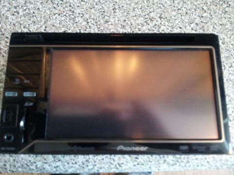 2002 Chrysler 300M - Pioneer car stereo unit with a touchscreen display and various control buttons.