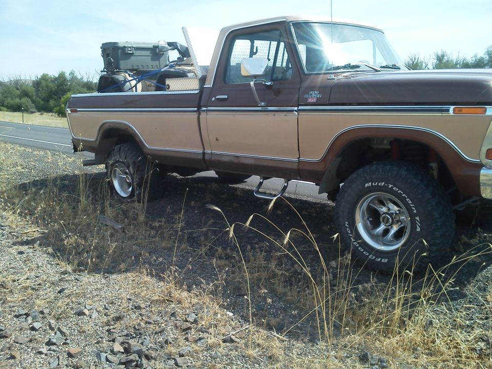 Brown and tan 1979 Ford F-150 pickup truck side view with cargo in bed