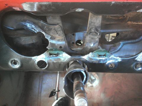 1964 Ford Fairlane - Close-up of the car's firewall and steering column assembly, showing recent welding work.