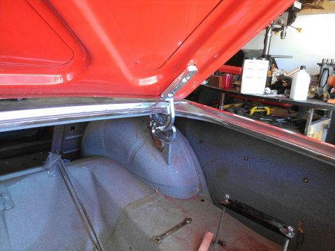 1964 Ford Fairlane - The trunk of a 1964 Ford Fairlane, with the lid open, revealing the interior and hinges.