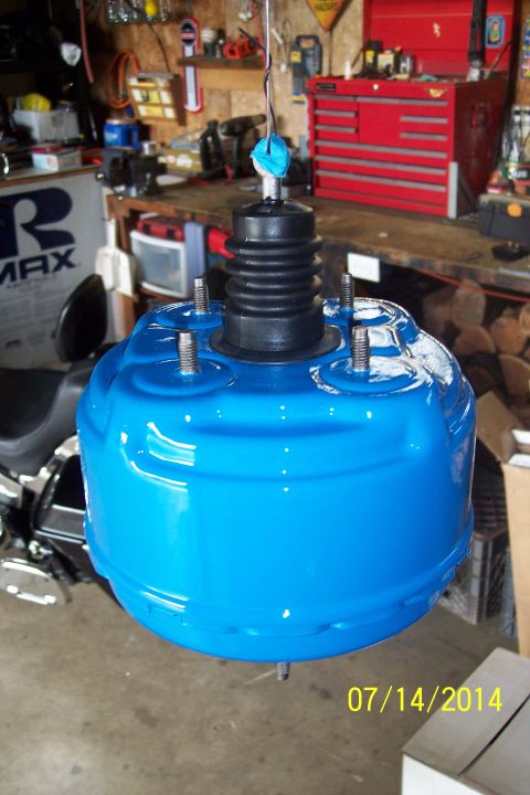 1978 Ford Bronco - A blue brake booster is suspended in a garage setting, with a date stamp of 07/14/2014 in the corner.