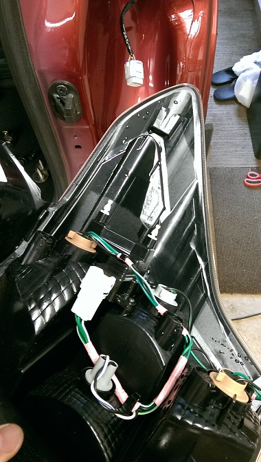 2015 Subaru Forester - Car taillight assembly with wiring and connectors visible.