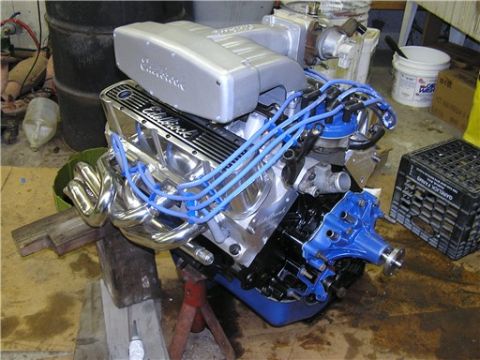 1993 Ford Bronco - Ford V8 engine assembly with Edelbrock components and chrome headers.