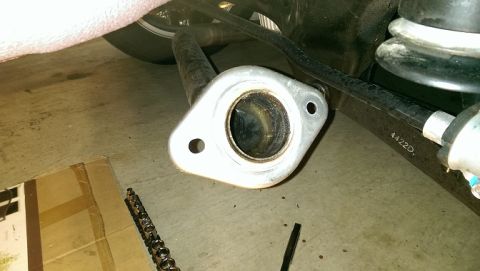 2015 Subaru Forester - Exhaust pipe flange with part number 4422D visible on a vehicle component.