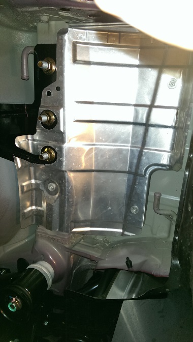 2015 Subaru Forester - Close-up view of an underbody hitch component, showing its metallic structure and mounting hardware.