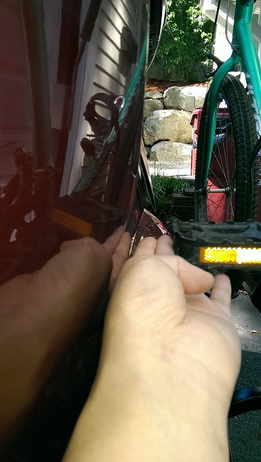 2015 Subaru Forester - A close-up view of bicycle pedals and frame, with hands visible in the foreground.
