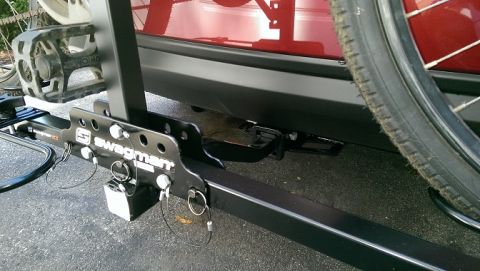 2015 Subaru Forester - A Swagman bike rack is attached to the hitch receiver of a red vehicle.