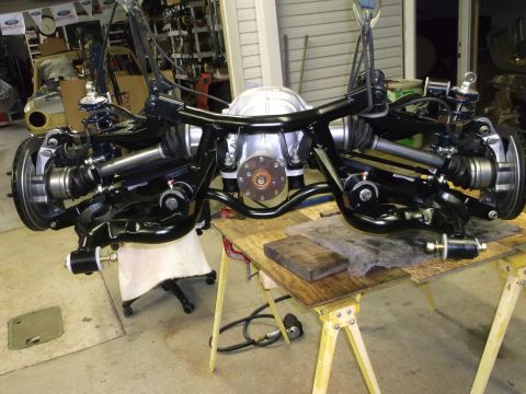 1967 Ford Mustang - Rear axle assembly and suspension components are shown disassembled and supported by sawhorses.
