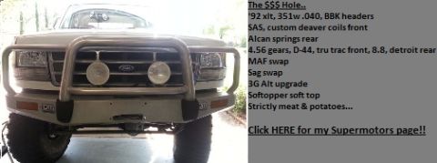 1992 Ford Bronco - Front view of a 1992 Ford Bronco with a large brush guard and winch-ready bumper.