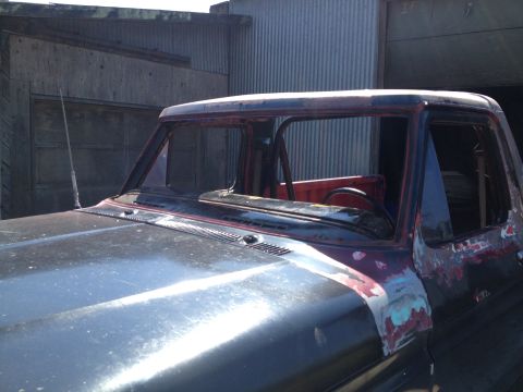 1978 Ford Bronco - This 1978 Ford Bronco shows significant wear and tear, with rust and primer visible on its body panels.