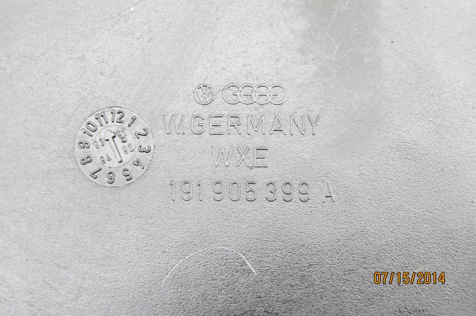 Part with Volkswagen logo, W. GERMANY, WXE, and part number 191 905 399 A. Includes a date code dial