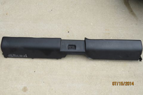 1985 Volkswagen Jetta - A black plastic automotive part is shown lying on a concrete surface.