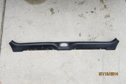1985 Volkswagen Jetta - This black plastic trim piece features a central oval cutout and mounting holes along its length.