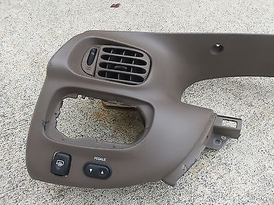 1996 Ford Bronco - Dashboard trim piece with air vent and pedal adjustment controls, likely from a truck or SUV.