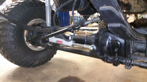 1988 Ford Bronco - This photo shows the undercarriage of a vehicle, focusing on the suspension and steering system components.