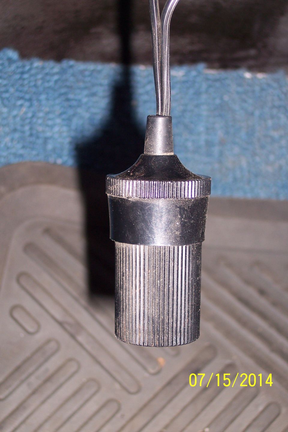 Close-up of a cigarette lighter socket with wires