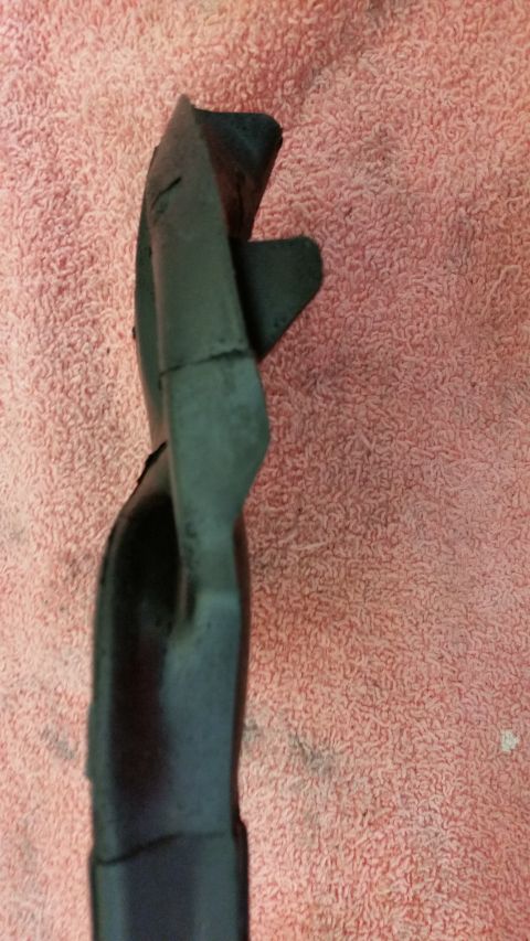 1973 Chevrolet Camaro - Unidentified black plastic car part on a pink towel. Watermark indicates source is SUPERMOTORS.NET.