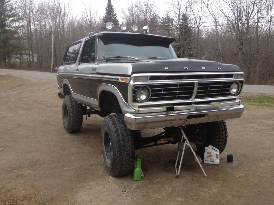 Two-tone lifted 1979 Ford Bronco with roof lights and aftermarket grille