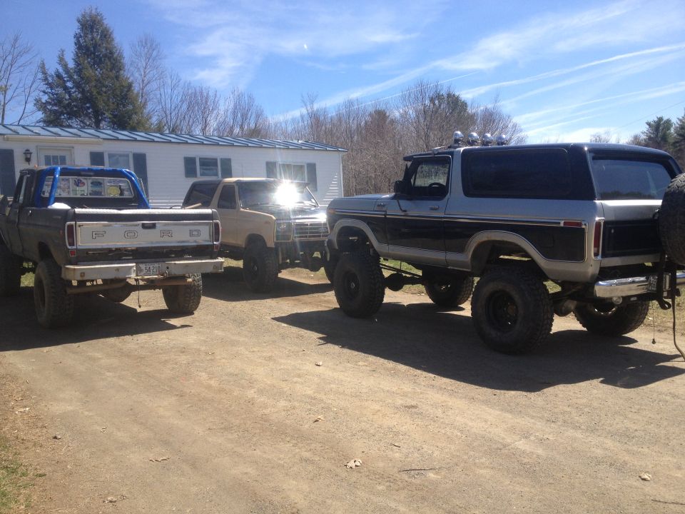 Rear view of a lifted 1979 Ford Bronco with a spare tire mount