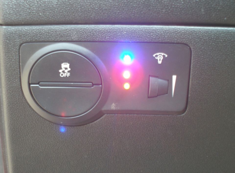Dashboard with traction control off button and indicator lights