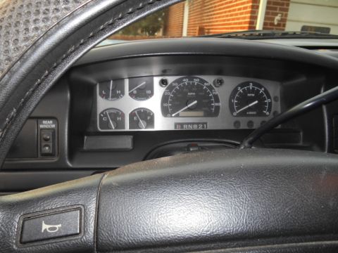 1994 Ford Bronco - Interior view of a 1994 Ford Bronco dashboard, showing gauges and gear selector.