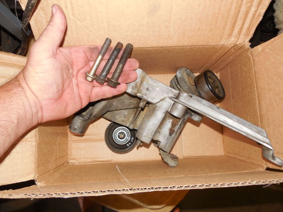 '93 Bronco 5.8L alternator bracket, pulleys, & bolts.