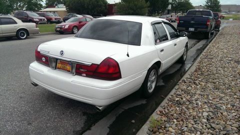 2000 Mercury Grand Marquis - Rear view of a white 2000 Mercury Grand Marquis parked curbside.