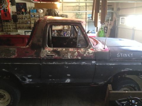 1978 Ford Bronco - This 1978 Ford Bronco shows significant wear and primer patches on its body panels.