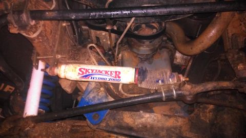 1990 Ford Bronco - Undercarriage view of a Skyjacker Hydro 7000 steering stabilizer, showing suspension components.