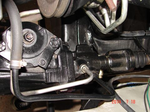 1979 Ford F-150 - A close-up view of the vehicle's power steering gearbox and associated hydraulic lines.