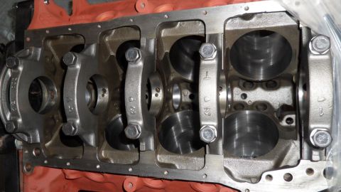 1972 Ford Ranchero - Close-up view of an engine block's crankshaft bearing saddles and connecting rods, some marked with numbers.