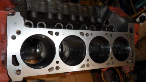 1972 Ford Ranchero - Close-up view of an engine block, showing machined cylinder bores and painted exterior sections.
