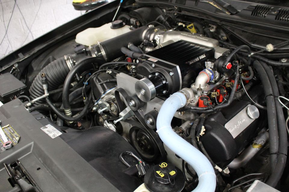 Supercharged engine bay with Kenne Bell blower and accessory belts