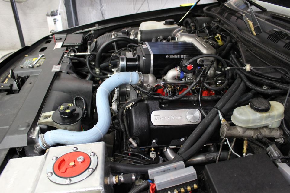 Supercharged engine bay with Trick Flow cover and brake master cylinder