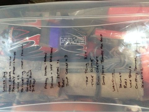 1979 Ford Bronco - A plastic bag contains various items, each labeled by hand, suggesting an organized kit for outdoor activities or vehicle recovery.